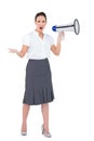 Stern businesswoman yelling in her megaphone Royalty Free Stock Photo