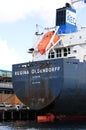 Stern of cargo ship with emergency rescue vessel