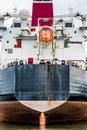 Stern of a container ship with orange life raft