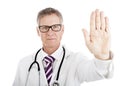 Stern doctor holding up his hand in a Halt gesture