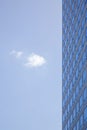 Stern facade of office building and one cloud Royalty Free Stock Photo