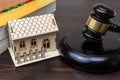 A stern judge, gavel in hand, stands before a wooden table in a courtroom. Justice is being served as an eviction due to unpaid Royalty Free Stock Photo