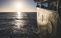 Stern of an old ship at sunset, travel concept