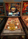 Stern pinball machine flanked by Nip It and Superman Royalty Free Stock Photo