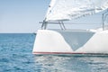 Stern with a sail of a white sport keelboat yacht Royalty Free Stock Photo