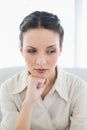 Stern stylish brunette businesswoman posing looking away