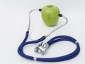 Stethoscope with green apple