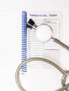 Stethoscop and planner on the doctor's table. Royalty Free Stock Photo