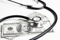 Stethoscope and 100 dollar bills Royalty Free Stock Photo