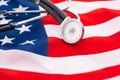 Stethoscope on American national flag, close up. creative photo.