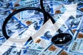 Stethoscope on the background of one hundred dollar bills. Royalty Free Stock Photo