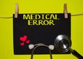 MEDICAL ERROR on top of yellow background Royalty Free Stock Photo