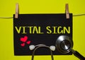 VITAL SIGN on top of yellow background Royalty Free Stock Photo