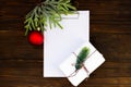 Stethoscope, blank clipboard and Christmas decorations on wooden white table