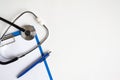 Stethoscope and blank clipboard isolated on white with blue pen Royalty Free Stock Photo