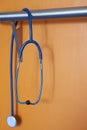 Stethoscope blue wall orange no people