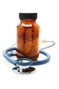Stethoscope and bottle of vitatmins