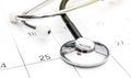 Stethoscope on calendar. Medical appointment concept Royalty Free Stock Photo