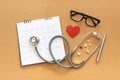 Stethoscope and calendar on wooden table, schedule to check up healthy concept Royalty Free Stock Photo