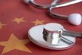 Stethoscope on China national flag.Corona Virus outbreak concept. China Crisis Royalty Free Stock Photo