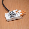 Stethoscope and cigarettes Royalty Free Stock Photo
