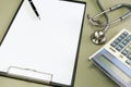 Stethoscope with clipboard on desk,Doctor working in hospital writing a prescription Royalty Free Stock Photo