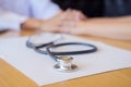 Stethoscope with clipboard and Laptop on desk Doctor working in Royalty Free Stock Photo