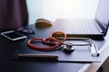 Stethoscope on clipboard and laptop with item,Healthcare and medical concept Royalty Free Stock Photo