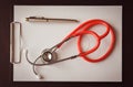 Stethoscope with clipboard and pen on desk Royalty Free Stock Photo