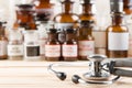 Stethoscope close up on vintage pharmaceutical bottles background - healthcare concept