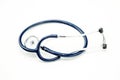 Stethoscope coiled on bright white surface Royalty Free Stock Photo
