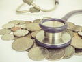 Stethoscope and coins vintage style