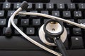 Stethoscope by a computer keyboard