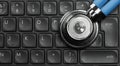 Stethoscope on computer keyboard Royalty Free Stock Photo