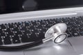 Stethoscope disc lying on the keyboard o a laptop Royalty Free Stock Photo