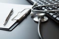 Stethoscope, Document Board, Keyboard computer, Notebook, Pen  on black background and copy space Royalty Free Stock Photo
