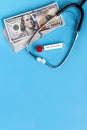 Stethoscope and dollars. Health costs during the epidemic of the coronavirus. Concept of payment for medical services in a crisis Royalty Free Stock Photo