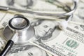 Stethoscope on the dollars. Medical costs. Healthcare payment concept Royalty Free Stock Photo