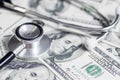 Stethoscope on the dollars. Medical costs. Healthcare payment concept. Concept of analysis of the market and economy and interest Royalty Free Stock Photo