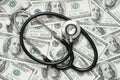 Stethoscope on the dollars. Medical costs. Healthcare payment concept. Concept of analysis of the market and economy and interest Royalty Free Stock Photo