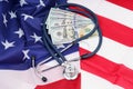 Stethoscope and dollars on the USA flag