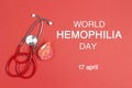 Stethoscope and a drop of blood on a red background. World Hemophilia Day background