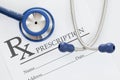 Stethoscope with drug prescription on table