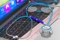 Stethoscope and ECG on laptop keyboard Royalty Free Stock Photo