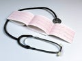 Stethoscope. Electrocardiogram (ECG) result Royalty Free Stock Photo