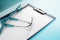 Stethoscope and empty document in a clipboard Royalty Free Stock Photo