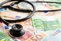 Stethoscope and the euro banknotes Royalty Free Stock Photo