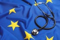 Stethoscope on flag of European Union. Space for text Royalty Free Stock Photo