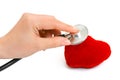 Stethoscope in hand and heart Royalty Free Stock Photo