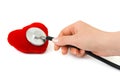 Stethoscope in hand and heart Royalty Free Stock Photo